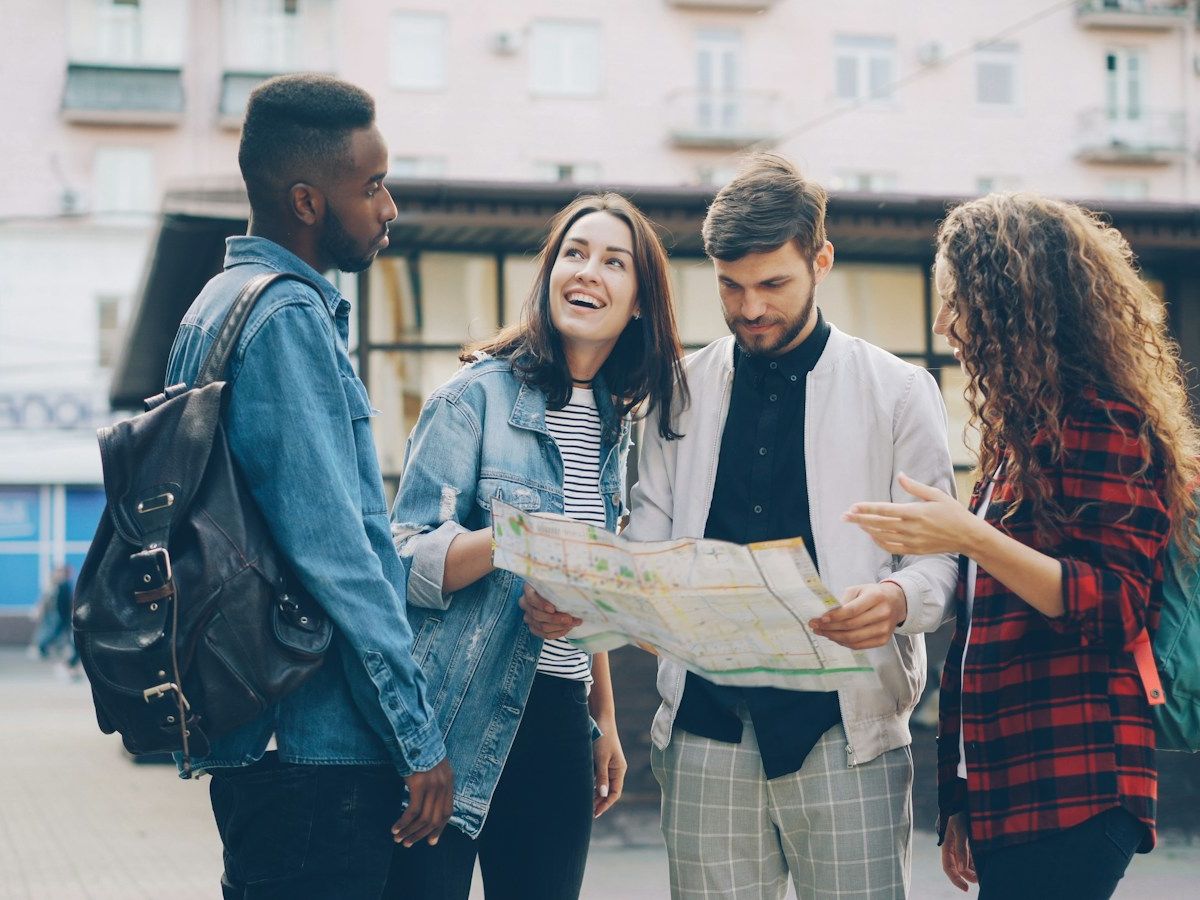 Friends reading a city map together